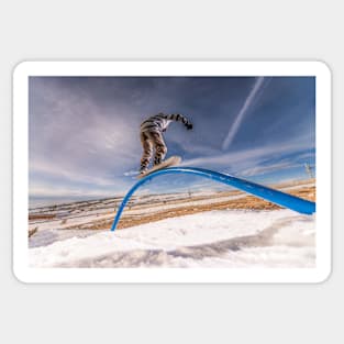 Snowboarder sliding on a rail Sticker